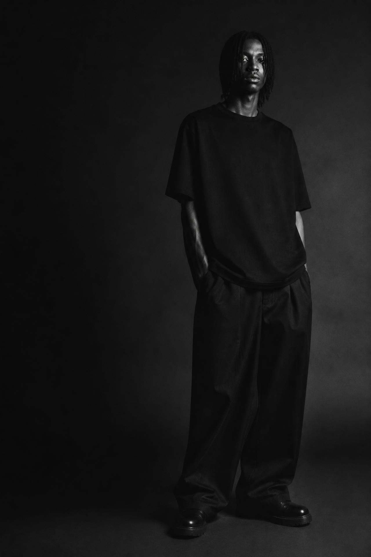 OPEN CLOTHING campaign — oversized heavyweight tee photographed in daylight